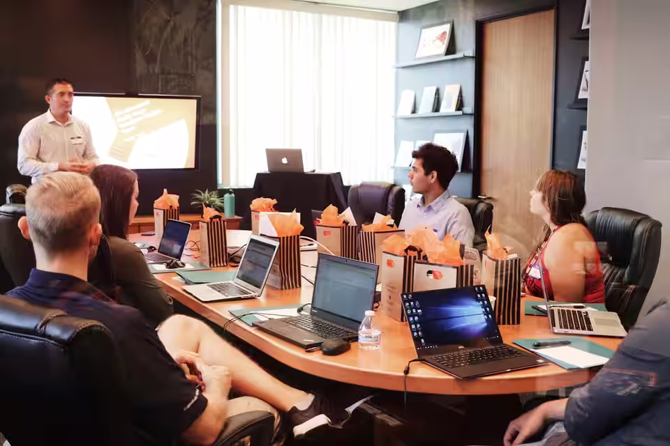 Senior advisors reviewing valuation analysis with business leadership