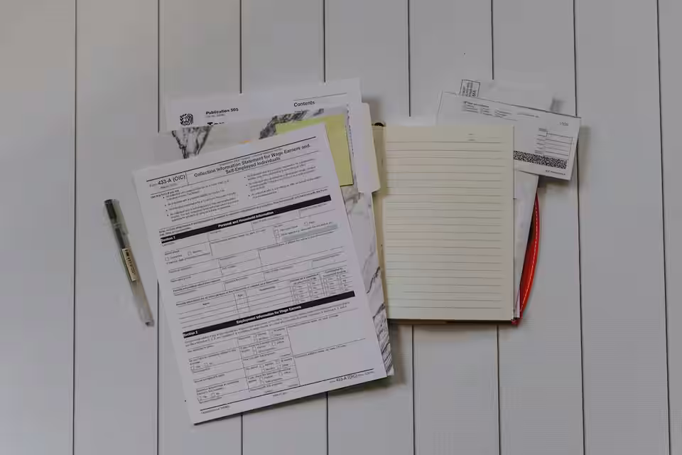 Entrepreneurs and tax consultants reviewing business registration documents in a modern office